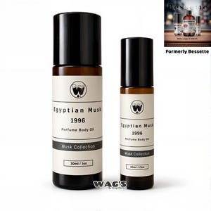 May include: Two perfume body oil bottles, one large and one small, with black caps and brown glass. The labels read "Egyptian Musk 1996 Perfume Body Oil" and "Musk Collection". The larger bottle is 30ml/1oz, and the smaller is 10ml/.3oz.