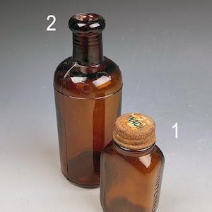 Two antique amber medicine bottles, small vintage bottle, mini bottles