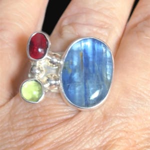 Adjustable sterling silver ring with tanzanite peridot and garnet