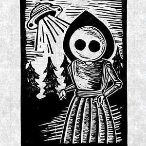 May include: Black and white woodcut print of a hooded figure with large eyes standing in a forest with a flying saucer in the background. The text "Flatwood Monster" and "Roe" are at the bottom of the print.