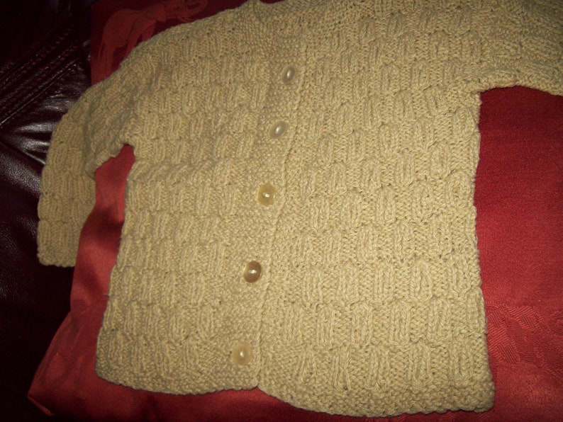 A Vintage hand knitted girls cardigan
