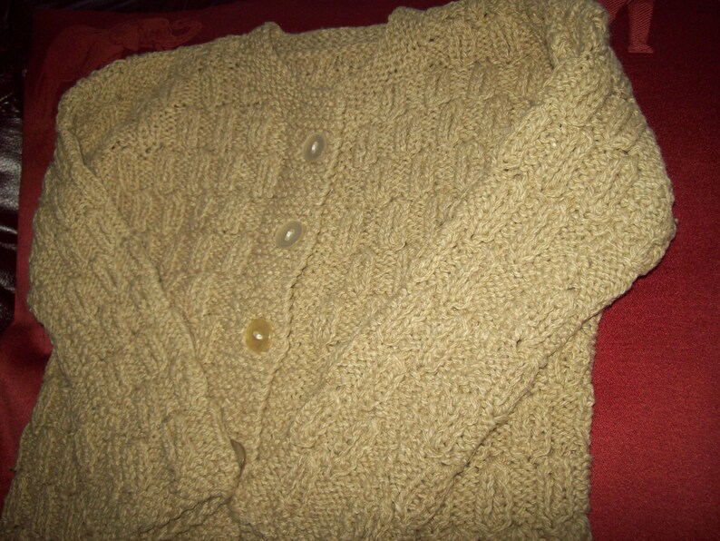 A Vintage hand knitted girls cardigan