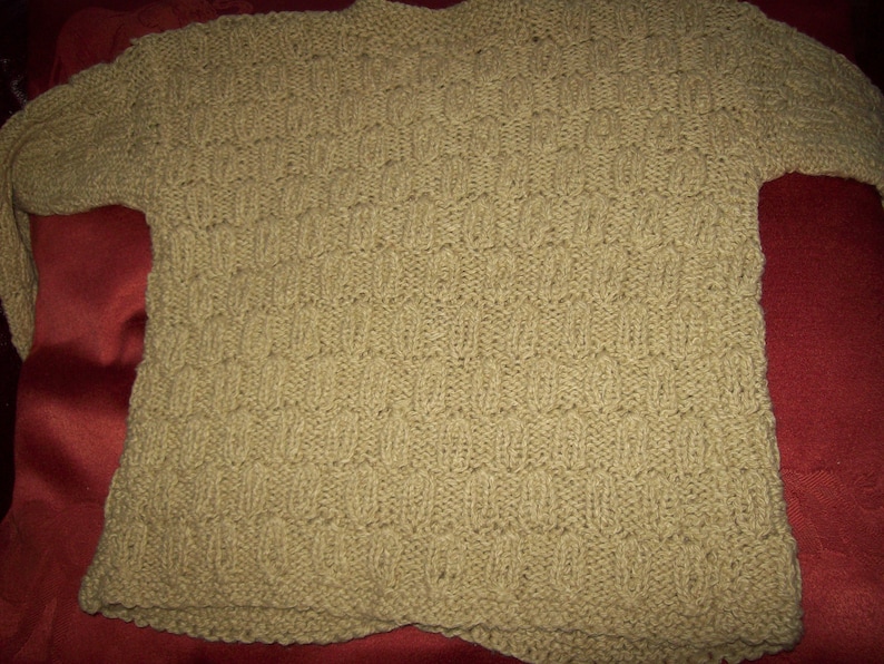 A Vintage hand knitted girls cardigan