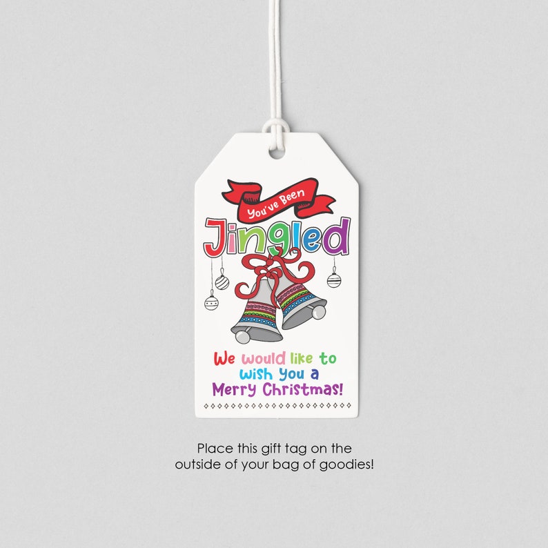 May include: A white gift tag with a red ribbon that says "You've Been Jingled". The tag also has a colorful illustration of two jingle bells and the text "We would like to wish you a Merry Christmas!"