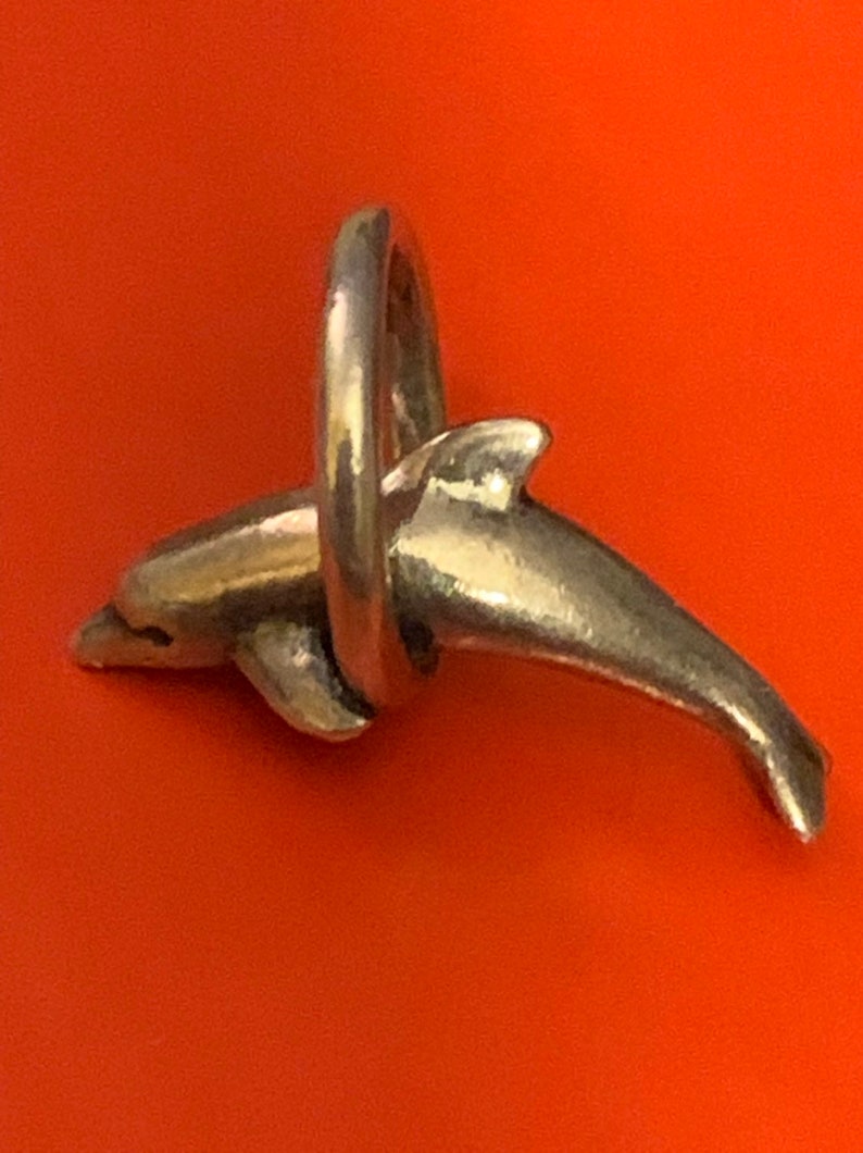 James Avery dolphin and hoop Retired nice hallmark excellent condition 925SS