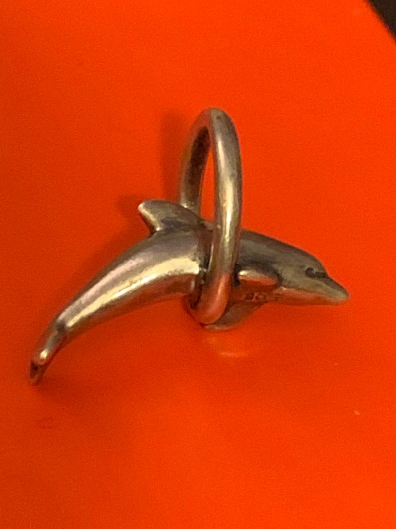 James Avery dolphin and hoop Retired nice hallmark excellent condition 925SS