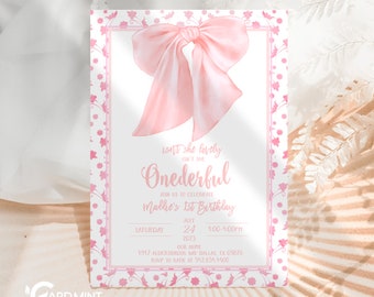 Puede incluir: Una invitación rosa y blanca con un gran lazo rosa y un borde floral. El texto dice "Isn't she lovely, Onederful, Join us to celebrate Mallie's 1st Birthday, Saturday, July 24, 2025, 1:00-4:00PM, Our Home, 1917 Aldersbrook Way Dallas TX 09876, RSVP to Katie at 542.654.4400."