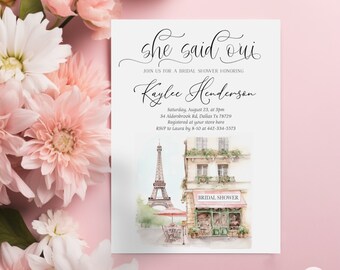 May include: A white bridal shower invitation with a watercolor illustration of the Eiffel Tower and a Parisian storefront. The text reads "She said oui" and "Kaylee Henderson".