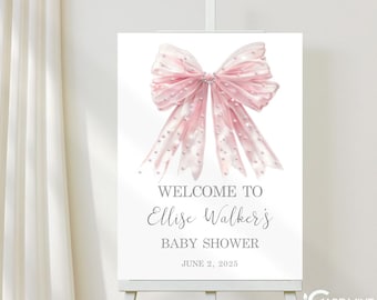 May include: A pink and white bow with polka dots on a white background. The text "Welcome to Ellise Walker's Baby Shower" is below the bow. The date "June 2, 2025" is below the text.