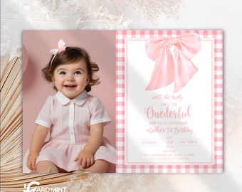 May include: Pink and white gingham patterned invitation with a large pink bow on top. The text reads "Isn't she lovely, Isn't she Onederful. Join us to celebrate Mallie's 1st Birthday. Saturday, July 24, 1:00-4:00pm, 7025 Our Home, 1917 Alderbrook Dr, Dallas, TX 09576, RSVP to Sandy at 512-545-4100."