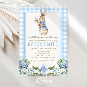 May include: Baby shower invitation featuring a watercolor illustration of Peter Rabbit holding a carrot, set against a blue gingham background. The invitation includes details for Betsy Smith's baby shower, with floral accents.
