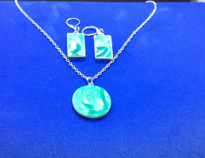 Beautiful turquoise blue swirls pendant and earring set.