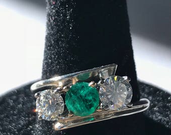 14 karat white gold three stone ring diamond and emerald