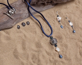 Beautiful, Exotic Swimming Mermaid Bead Necklace and Earring Set. Sculpted in pewter, the mermaid bead incorporates beautiful details.
