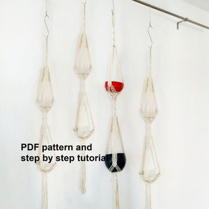 May include: Three macrame plant hangers with a black pot, a red pot, and an empty hanger. The hangers are made with natural coloured cord and have a tassel at the bottom. The text "PDF pattern and step by step tutorial" is visible at the bottom of the image.