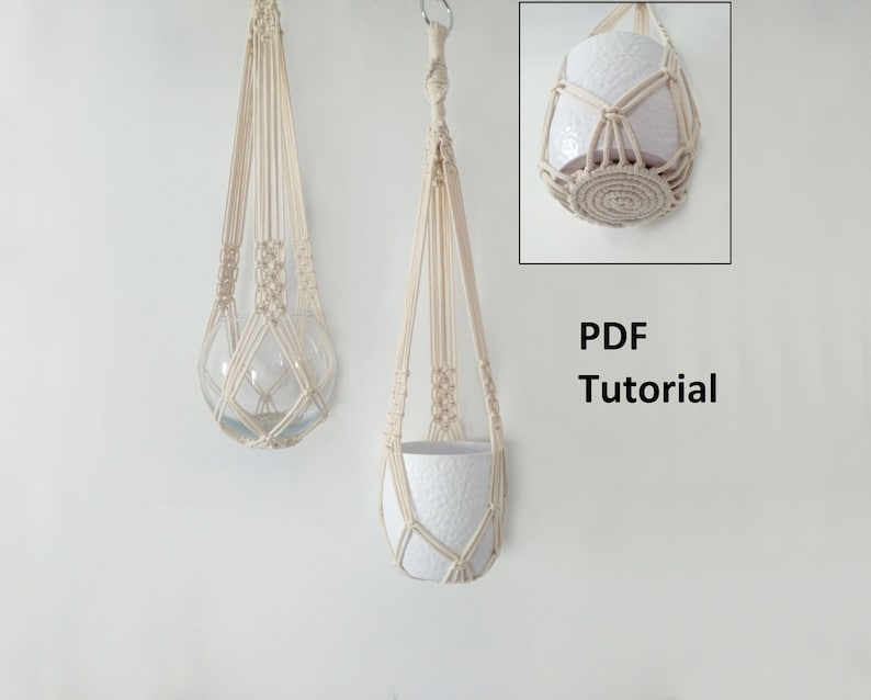 May include: Two macrame plant hangers, one with a clear glass sphere and the other with a white ceramic pot. Both hangers are made with natural colored cord and have a simple, geometric design. The image includes the text "PDF Tutorial".