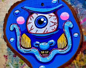 Burbleź, Merry Monsters: Adorno de madera azul único, pintado a mano, de Fragz