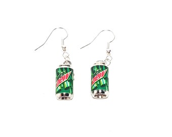 May include: A pair of silver dangle earrings featuring a green and red Mountain Dew can charm.