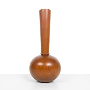 May include: A wooden vase with a round base and a tall, slender neck. The vase is made of a dark brown wood with a smooth finish.