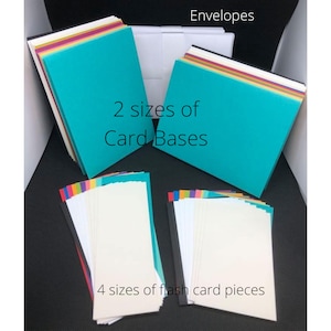 May include: A collection of colorful cardstock paper in various sizes, including envelopes, card bases, and flash card pieces. The cardstock is arranged in stacks and labeled with the text "Envelopes", "2 sizes of Card Bases", and "4 sizes of flash card pieces".