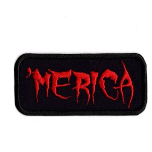 May include: A black rectangular patch with a red embroidered word "'MERICA" in a stylized font.