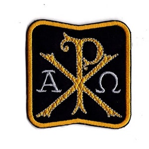 May include: A black and gold embroidered patch featuring the Greek letters Alpha and Omega, and the symbol Chi Rho, representing the first two letters of Christ's name in Greek.