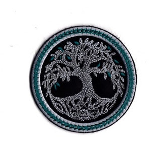 May include: A round embroidered patch featuring a silver tree of life design on a black background. The tree is encircled by a teal and silver border.