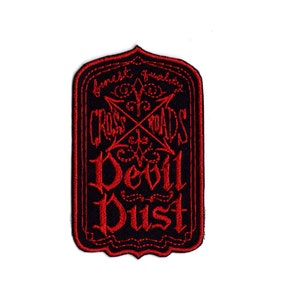 May include: Black and red embroidered patch with the text "Devil Dust" and "Cross Roads" in a gothic font.