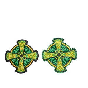 May include: Two embroidered Celtic cross patches. Each patch features a green and yellow Celtic knot design on a black background. The crosses are circular with intricate knotwork and a central black dot.