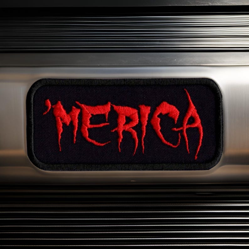 May include: A black patch with red embroidered lettering that reads "MERICA".