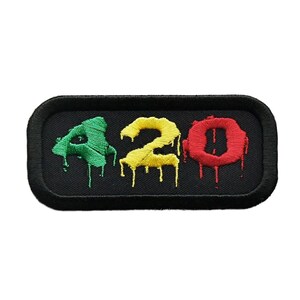 May include: Black rectangular patch with the number 420 in dripping paint. The 4 is green, the 2 is yellow, and the 0 is red.