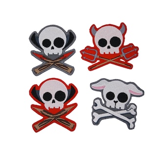 May include: Four embroidered patches featuring skull designs. Each skull has a unique design, including crossed oars, pitchforks, and bunny ears. The patches are in shades of white, red, gray, and brown, with black eye sockets.