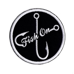 May include: White embroidered fishing hook with the text "Fish On" on a black circular patch.
