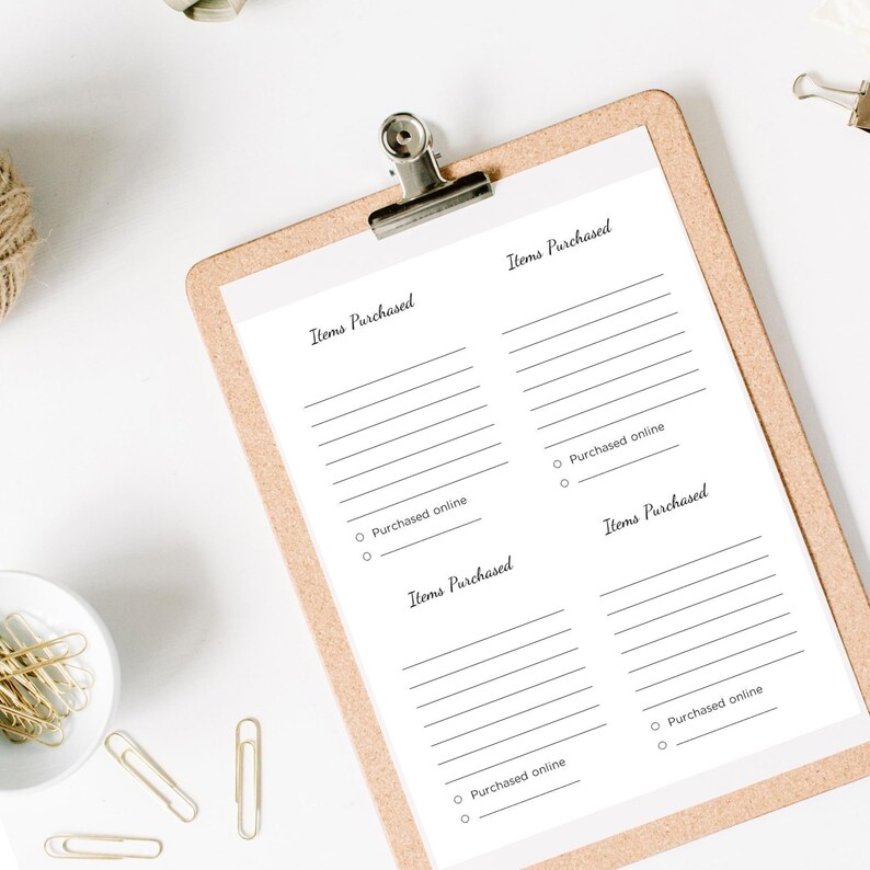 May include: A clipboard with a light brown wooden backing holds a white paper with the words "Items Purchased" printed in black. The paper has lines for writing and circles for checking "Purchased online."