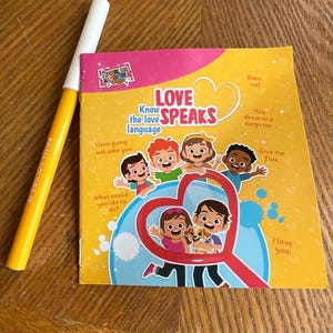 May include: A yellow and red book with the title "Love Speaks" and the text "Know the love language". The book features illustrations of children and a dog.