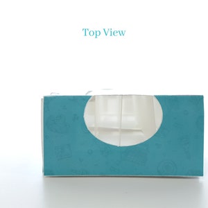May include: Top view of a teal blue box with a white cutout in the shape of a circle. The box has a pattern of small white designs on it. The text "Top View" is printed in blue above the box.