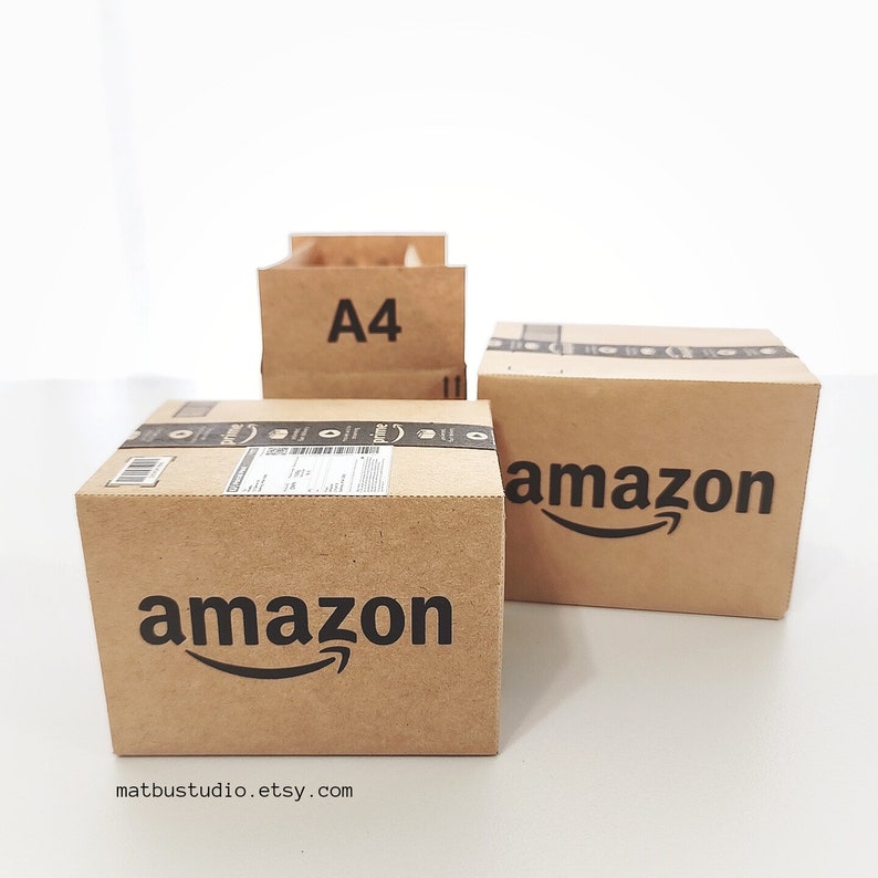 May include: Three cardboard boxes with the Amazon logo printed on them. The top box is labeled "A4".