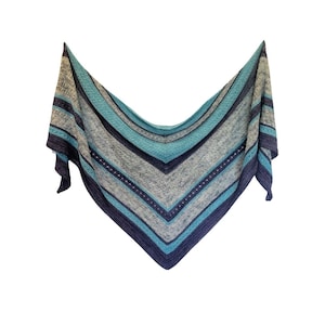 May include: A triangular shawl with a striped pattern in shades of blue and grey. The shawl is crocheted with a delicate stitch and has a fringed edge.