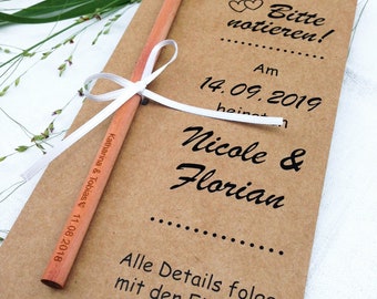 Save the date card with pen, wedding invitation, personalized guest gift