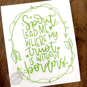 May include: Green vinyl decal with a quote that reads "Spirit: Lead me where my trust is without borders." The quote is surrounded by a decorative border of arrows and swirls.