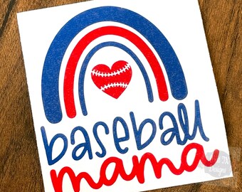 May include: A red and blue rainbow with a red heart containing a white baseball in the center. The text "baseball mama" is written below the rainbow in blue and red.