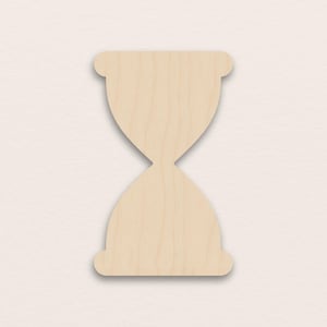 May include: A wooden hourglass shape, cut from light-colored wood. The hourglass has a classic design with rounded top and bottom sections, connected by a narrow waist. The wood grain is visible.