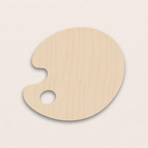 Könnte beinhalten: Eine Holzmalpalette mit Daumenloch und nierenförmigem Design. Die Palette besteht aus hellfarbigem Holz und hat eine glatte Oberfläche. Sie dient zum Halten und Mischen von Farben.
