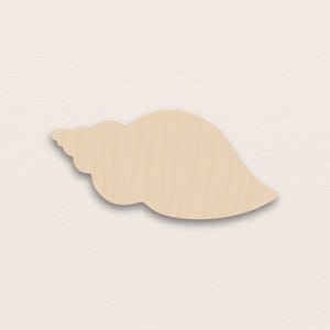 May include: A wooden seashell cutout, with a spiral at one end and a curved, smooth shape. The natural wood grain is visible, set against a neutral background. This craft supply is ideal for beach-themed projects and coastal decor.