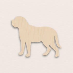 Puede incluir: Recorte de madera de color marrón claro con forma de perro, representado de pie. La superficie es lisa y se ve una sombra debajo. El diseño es una silueta simplificada de un perro.