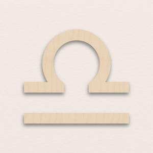 Könnte beinhalten: Ein hölzernes Waage-Sternzeichen-Symbol mit einem gebogenen Oberteil und einer horizontalen Basis. Das Symbol ist hellbraun und scheint aus einem einzigen Holzstück geschnitten zu sein. Der Hintergrund ist hellbeige.