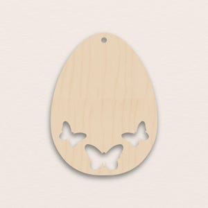 May include: A light-colored wooden Easter egg ornament with three butterfly cutouts. The egg shape has a small hole at the top for hanging. The butterflies are evenly spaced across the bottom half of the egg.
