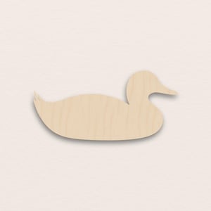 May include: A wooden duck-shaped cutout, with a light-coloured, natural wood grain. The duck is shown in profile, with a curved body, a small tail, and a detailed head and beak. Suitable for crafts and DIY projects, this cutout is a charming addition.