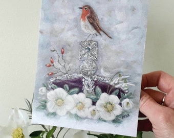 May include: A watercolor painting of a robin perched on a silver crown with white flowers and red berries surrounding it. The background is a light gray with a watercolor effect.