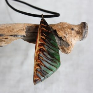 Pendant from a cut of a natural cone filled with green epoxy resin, a natural gift for a loved one, forest cone pendant, triangular pendant